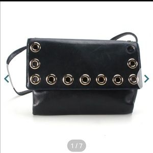 Givenchy Grommet Flip Bag in dark navy.  Leather